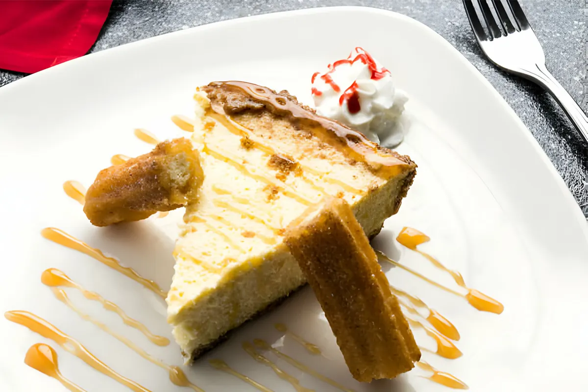 Churro Cheesecake - A decadent dessert with a golden churro crust and creamy cheesecake filling.