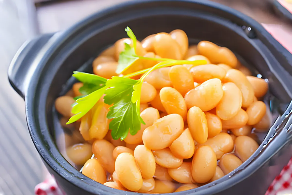 A comforting and nourishing bowl of butter beans, simmered to perfection with savory ingredients, offering warmth and satisfaction on a cold day.