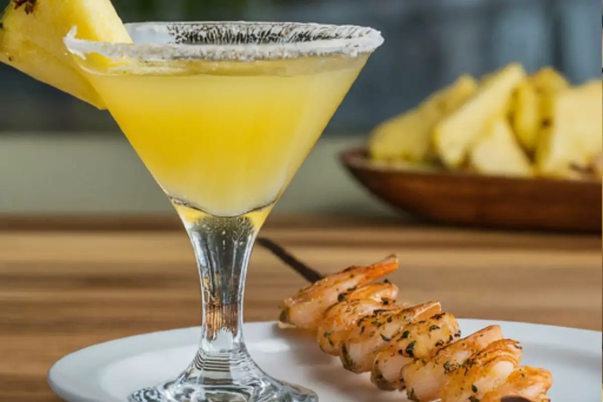 Pineapple Martini with grilled shrimp skewers