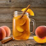 Homemade Peach Cobbler Moonshine in a mason jar,