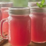 Finished Watermelon Moonshine in mason jars.