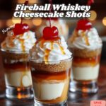 Fireball Whiskey Cheesecake Shots in small glasses topped with whipped cream.